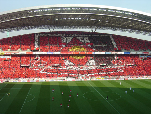 Urawa-Heimspiel gegen Gamba Osaka in der Saison 2006/07.<br />Bild: Green Törtels Oldenburg“><figcaption>Urawa-Heimspiel gegen Gamba Osaka in der Saison 2006/07.<br />Bild: Green Törtels Oldenburg</figcaption></figure>
            </div>

                    </article>

                <section class=