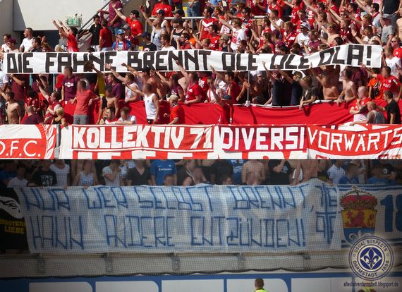 Spruchbänder beider Fanszenen. Alle Bilder vom Spiel gibt es oben in der Galerie. Bild: Allesfahrer Darmstadt