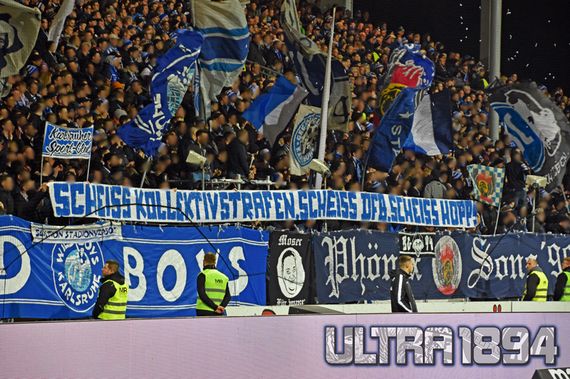 Spruchband der Ultras vom Karlsruher SC am vergangenen Freitag.<br />Bild: ULTRA1894.de”><figcaption>Spruchband der Ultras vom Karlsruher SC am vergangenen Freitag.<br />Bild: ULTRA1894.de</figcaption></figure>
                </div>
                
                <!-- YouTube (Meta-Feld) -->
                
            </div>
        </article>

                <script>
        (function() {
            var root = document.querySelector('.ff-single-news-gallery');
            if (!root) return;
            var slides = root.querySelectorAll('.ff-single-news-gallery-slide');
            var dots = root.querySelectorAll('.ff-single-news-gallery-dot');
            var prev = root.querySelector('.ff-single-news-gallery-prev');
            var next = root.querySelector('.ff-single-news-gallery-next');
            var n = slides.length;
            if (n < 2) return;
            var i = 0;
            function closeAllImgInfo() {
                root.querySelectorAll('.ff-fv-img-info-host.is-info-open').forEach(function(host) {
                    host.classList.remove('is-info-open');
                    var b = host.querySelector('.ff-fv-img-info-btn');
                    var p = host.querySelector('.ff-fv-img-info-panel');
                    if (b) b.setAttribute('aria-expanded', 'false');
                    if (p) p.setAttribute('aria-hidden', 'true');
                });
            }
            function show(idx) {
                closeAllImgInfo();
                i = ((idx % n) + n) % n;
                for (var s = 0; s < n; s++) {
                    if (s === i) slides[s].removeAttribute('hidden'); else slides[s].setAttribute('hidden', '');
                }
                for (var s = 0; s < dots.length; s++) {
                    dots[s].classList.toggle('is-active', s === i);
                    dots[s].setAttribute('aria-selected', s === i ? 'true' : 'false');
                }
            }
            if (prev) prev.addEventListener('click', function() { show(i - 1); });
            if (next) next.addEventListener('click', function() { show(i + 1); });
            for (var d = 0; d < dots.length; d++) {
                (function(di) { dots[di].addEventListener('click', function() { show(di); }); })(d);
            }
        })();
        </script>
        
        <!-- Kommentare -->
                <section class=